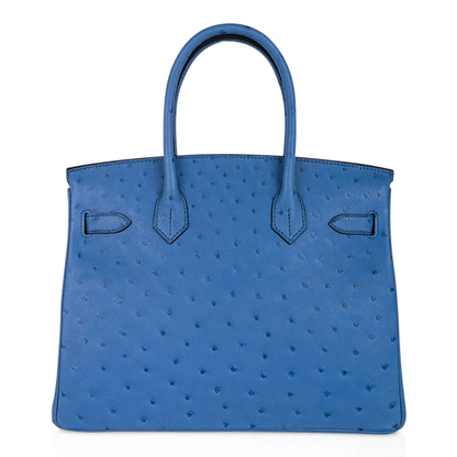 Vivid Mykonos Blue Tiny Raised Dot Medium Trapezoid Hand Carry Tote With Bright Golden Twist Lock Hardware And Matching Suspended Engraved Padlock Charm