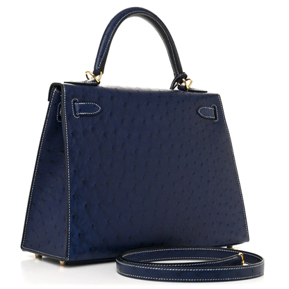 Deep Iris Navy Blue Tiny Raised Dot Compact Trapezoid Hand Carry Bag With Glossy Luminous Golden Twist Lock Hardware And Pale Contrast Edge Stitching