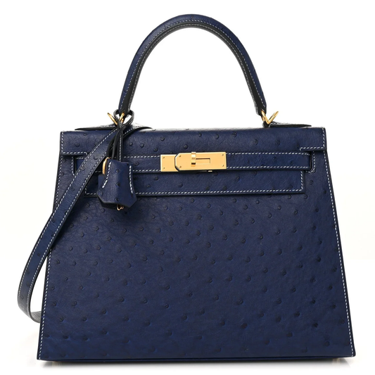 Deep Iris Navy Blue Tiny Raised Dot Compact Trapezoid Hand Carry Bag With Glossy Luminous Golden Twist Lock Hardware And Pale Contrast Edge Stitching