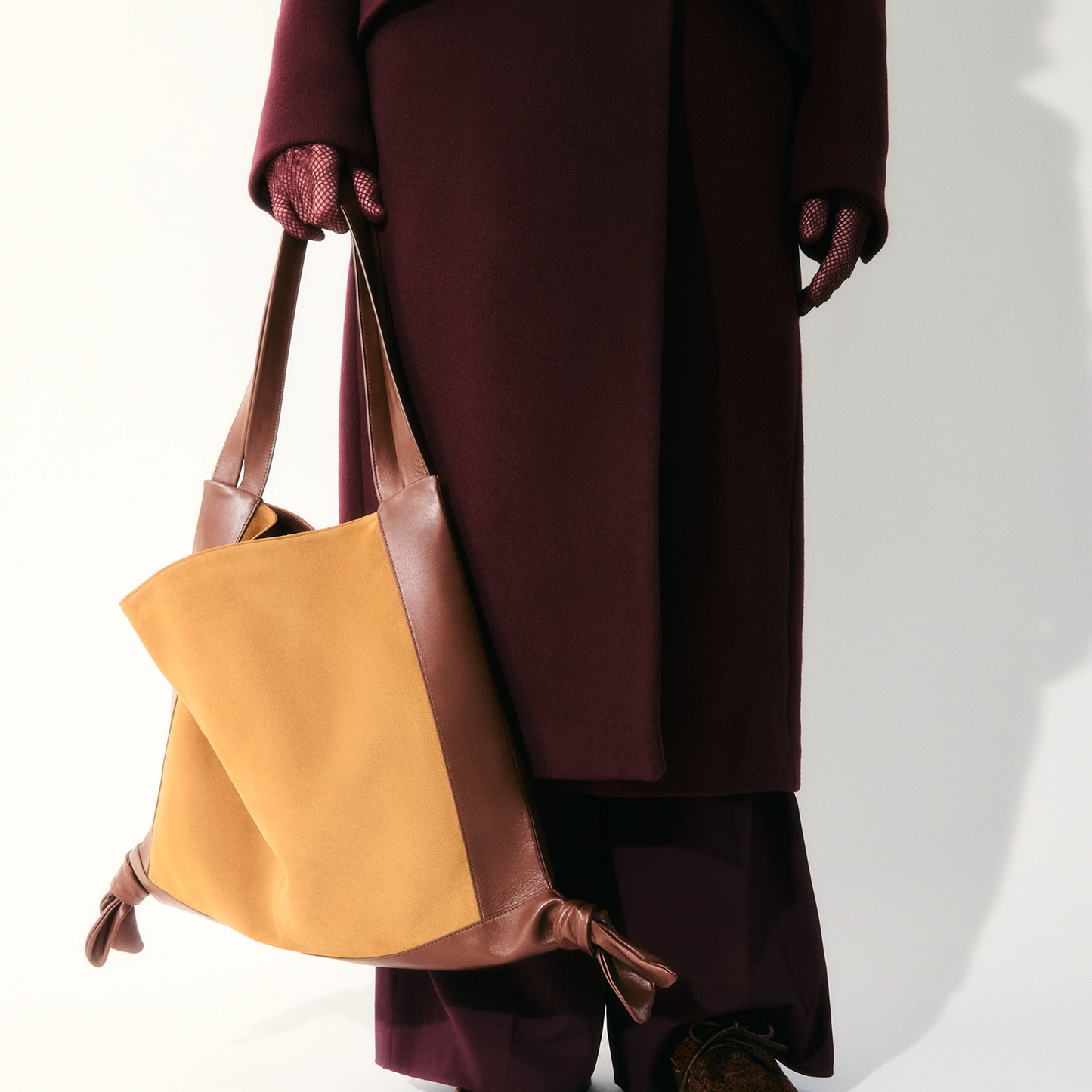 Warm Mustard Tan Cocoa Brown Two-Tone Slouchy Shoulder Tote With Decorative Knotted Corner Trim And Wide Shoulder Strap Panels